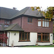 Rear view of the property showing bay windows